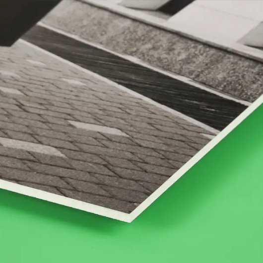 Fine art print of a village on forex, seen from the side showing the thin board