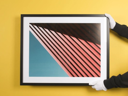 Street scene with a scooter as a Fine Art print, framed with a mount