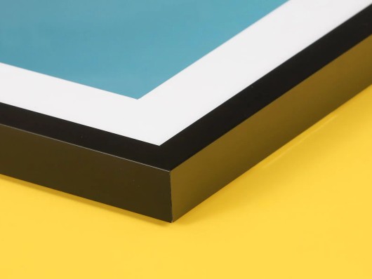 Side view of a framed Fine Art print with a mount